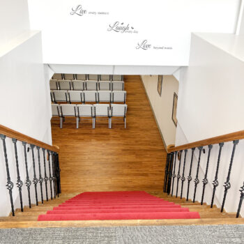 Chapel - Back of Chapel, top of stairs, quote on the wall (Live every moment, Laugh every day, Love beyond words)